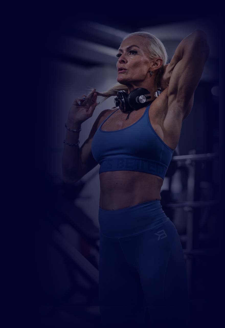 Coach Diva posing in the gym